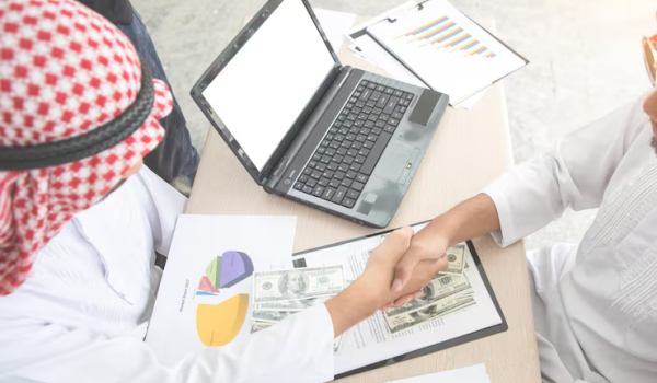 high-angle-view-business-people-shaking-hands-papers-table_1048944-307608-_1_