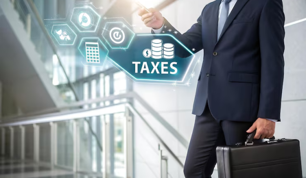 man-suit-is-holding-briefcase-sign-that-says-tax_1336851-6654